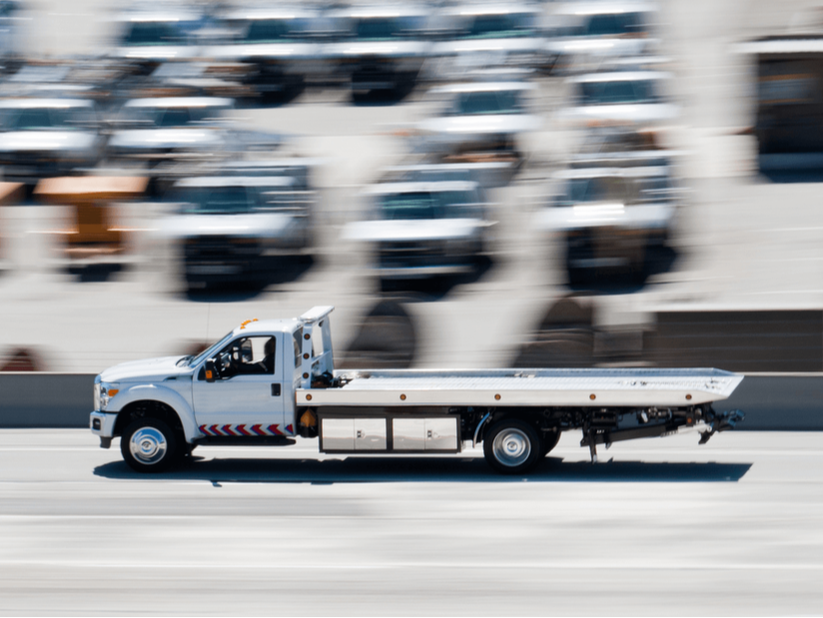Towing Services Towing with Flatbeds